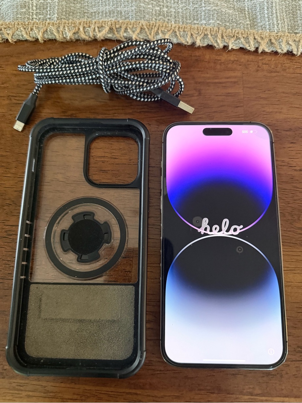 Apple iPhone with Clear-Back Case and Black Braided Cable